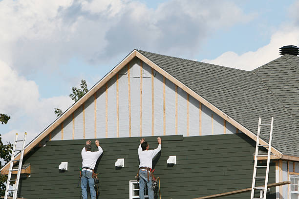 Professional Storm Damage Siding Repair technician working in Whiteford, MD